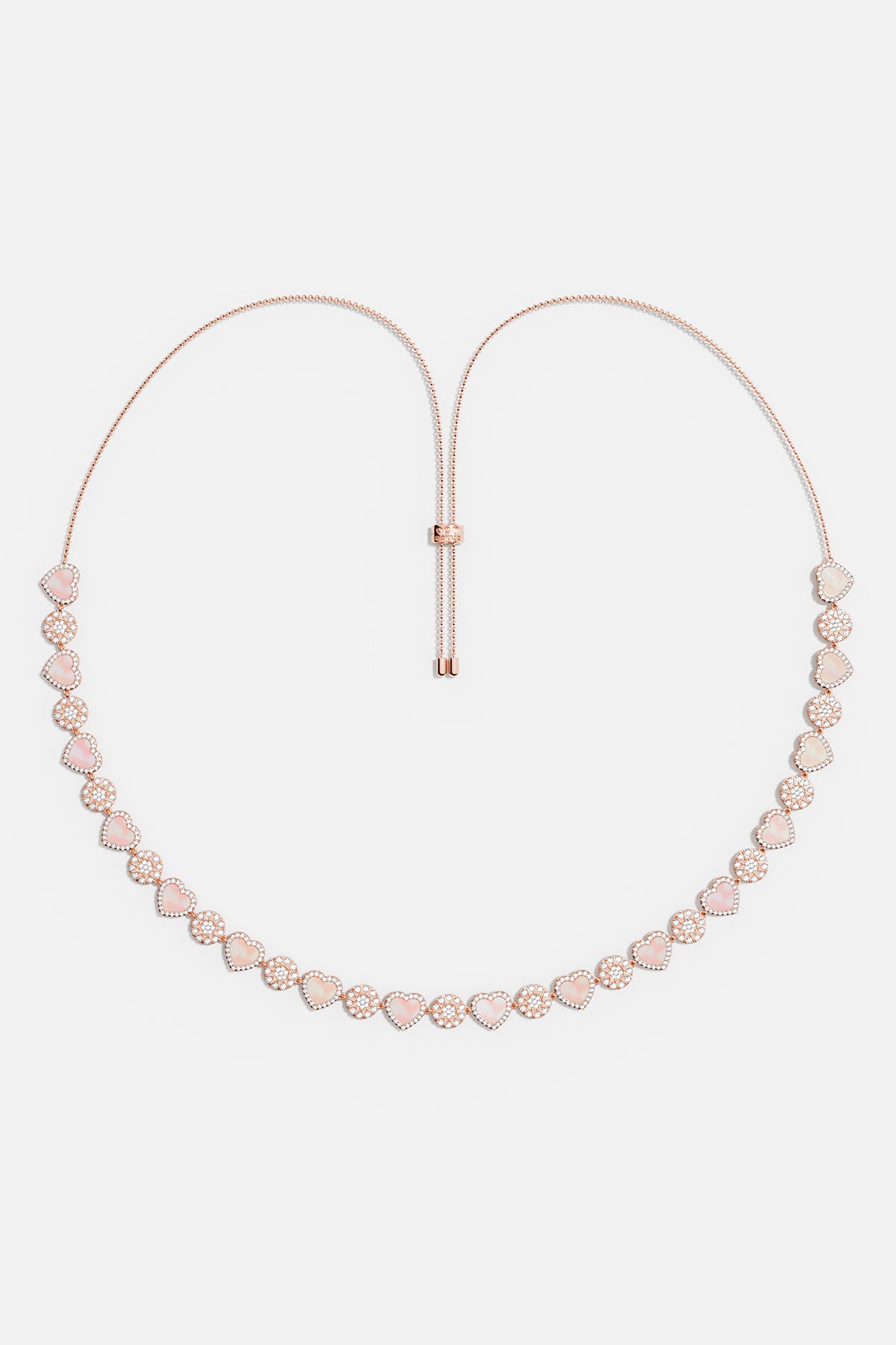 APM Necklace in rose rhodium finish, a tender cascade of hearts and sparkle.