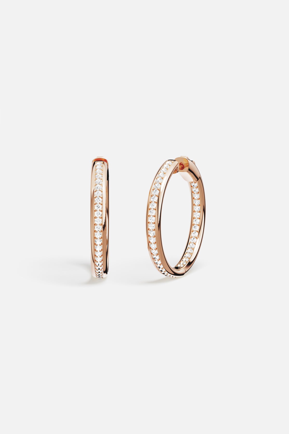 APM Monaco hoop earrings in rose color, effortless sparkle for every day.