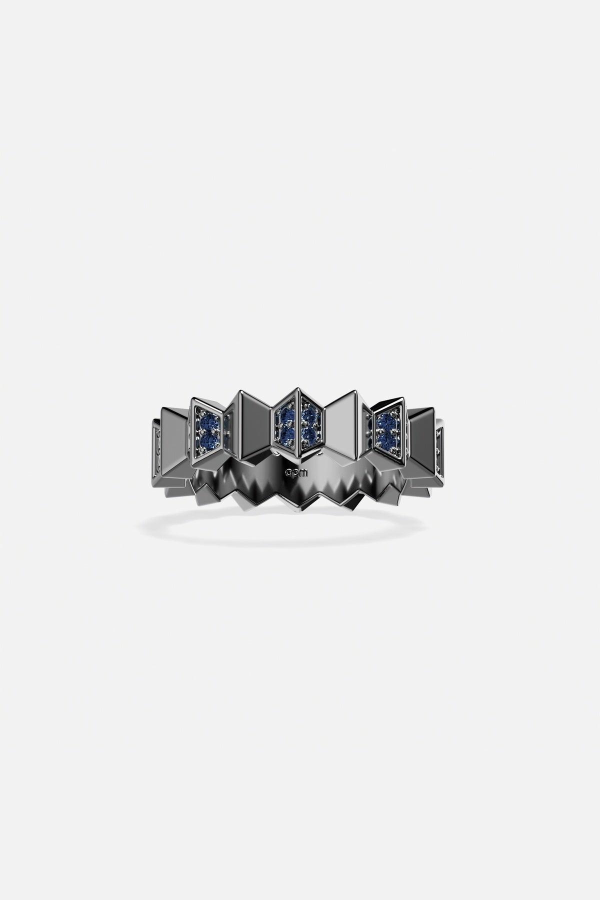 APM Ring in dark rhodium finish with deep blue stones, boldly architectural.