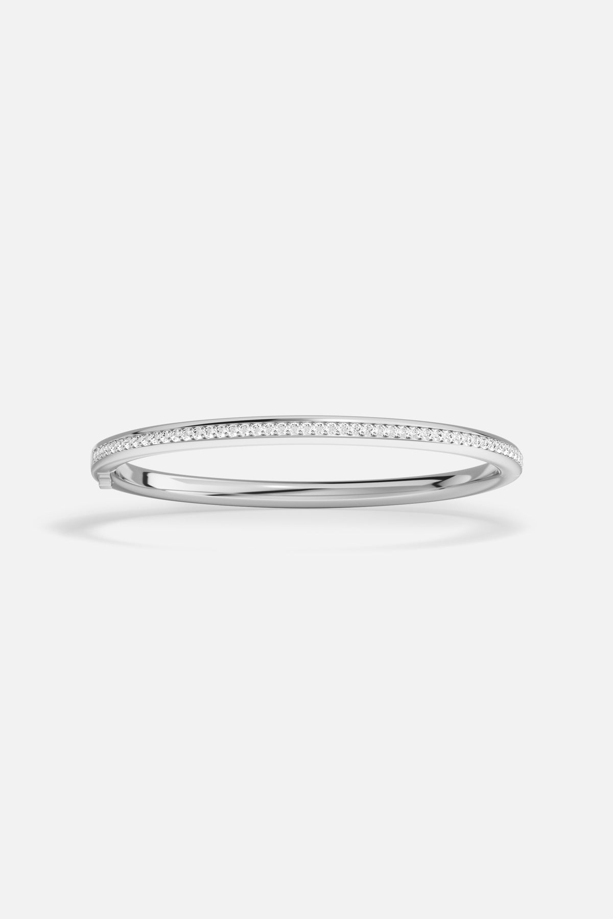 APM Bangle in rhodium finish, a luminous line of effortless elegance.