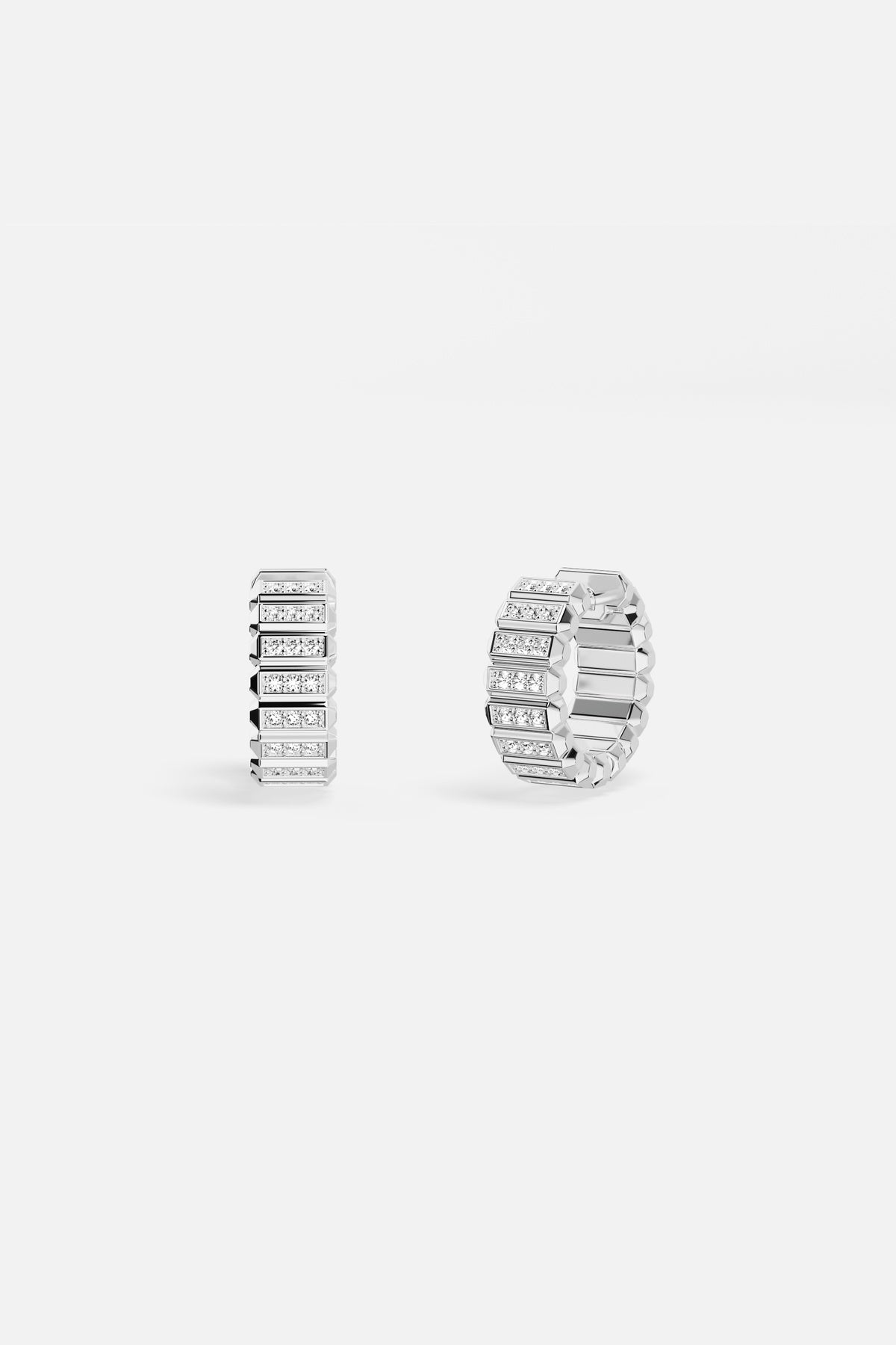 APM Hoop Earrings, architectural shimmer with rhodium finish, effortlessly modern.