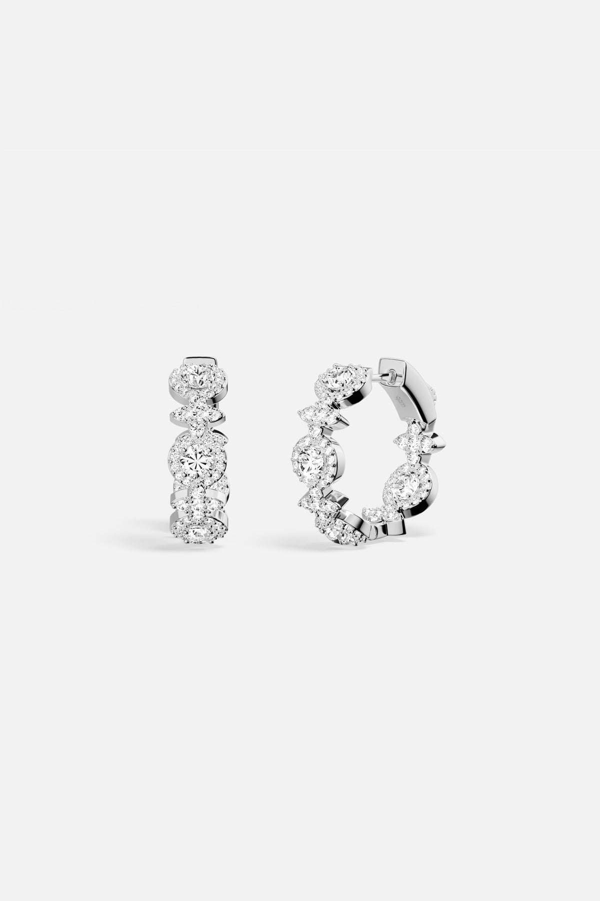 APM Hoop Earrings in rhodium finish, a radiant whisper of everyday elegance.