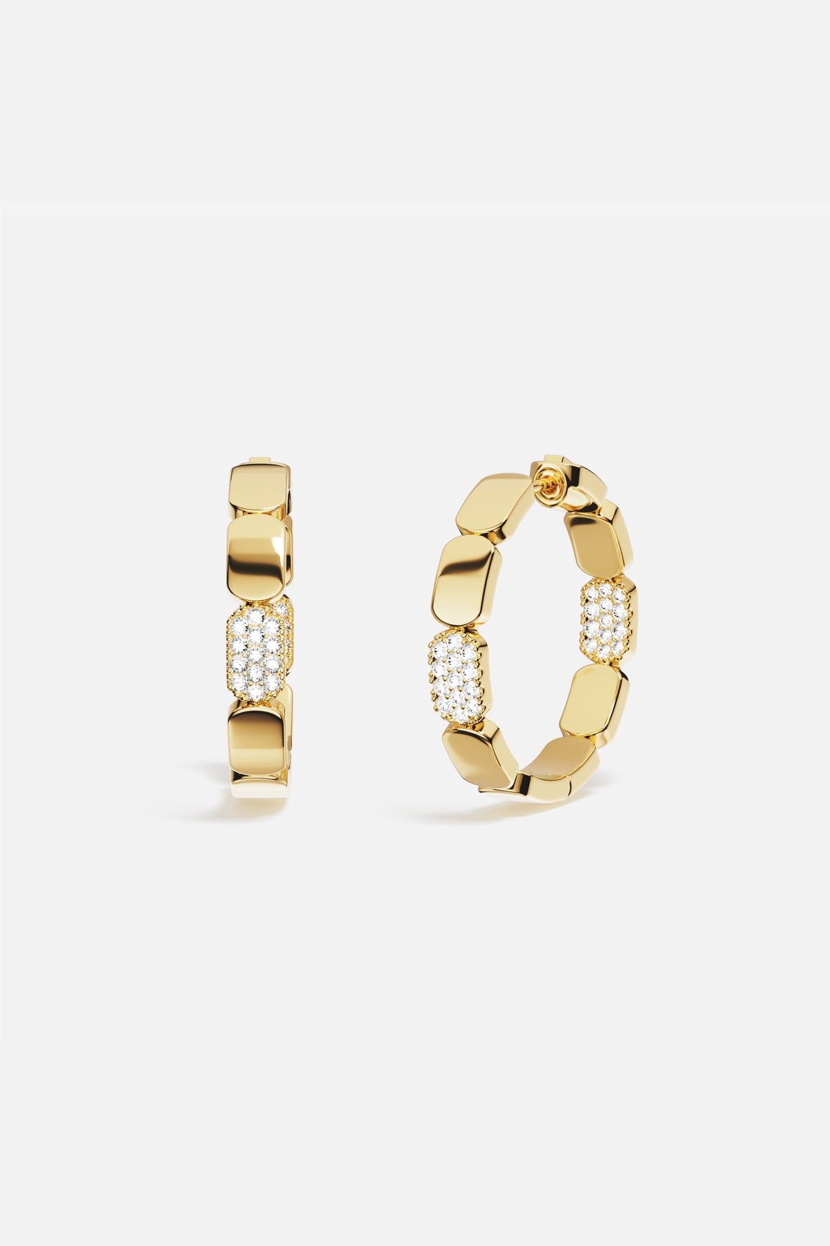 APM Hoop Earrings in golden hues, a bold rhythm of modern elegance.