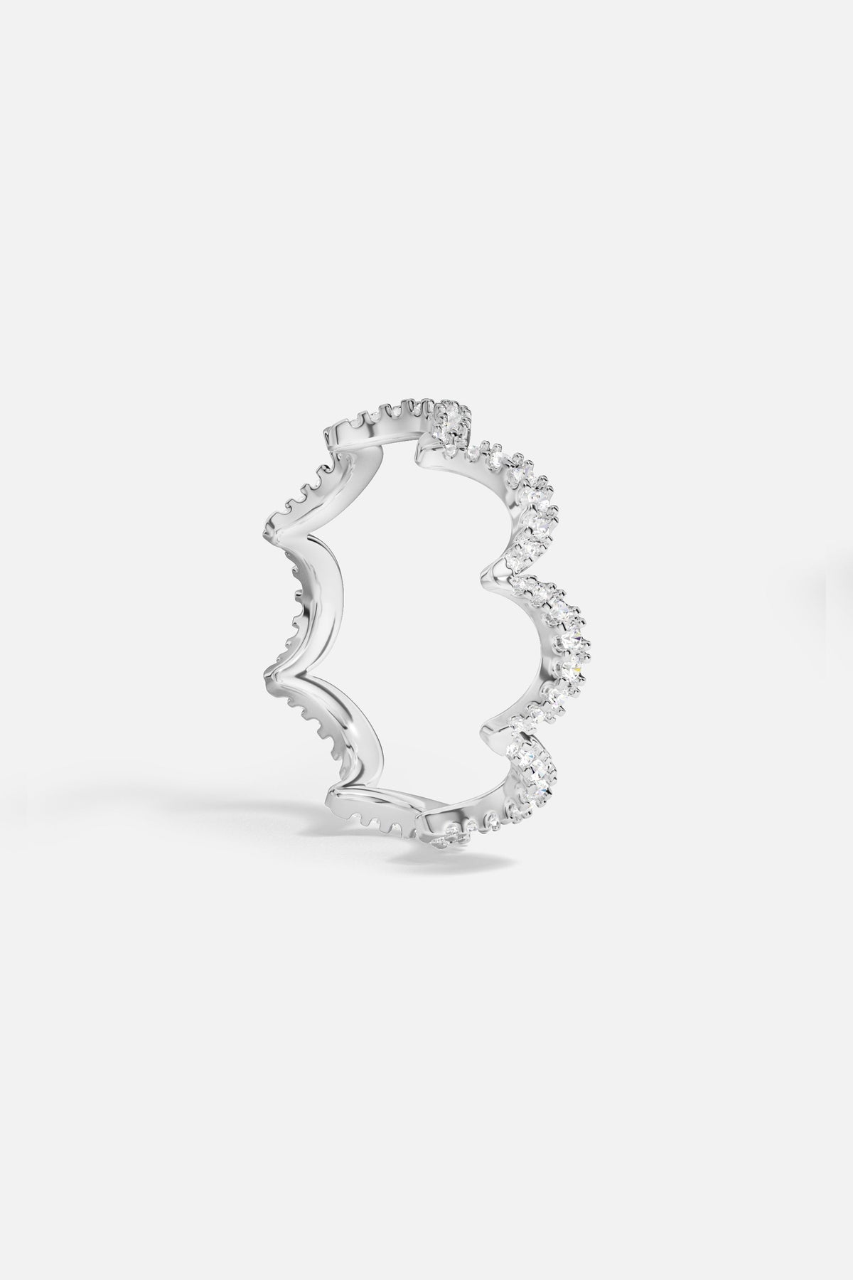 APM wave ring in rhodium finish, sparkling with effortless modern romance.