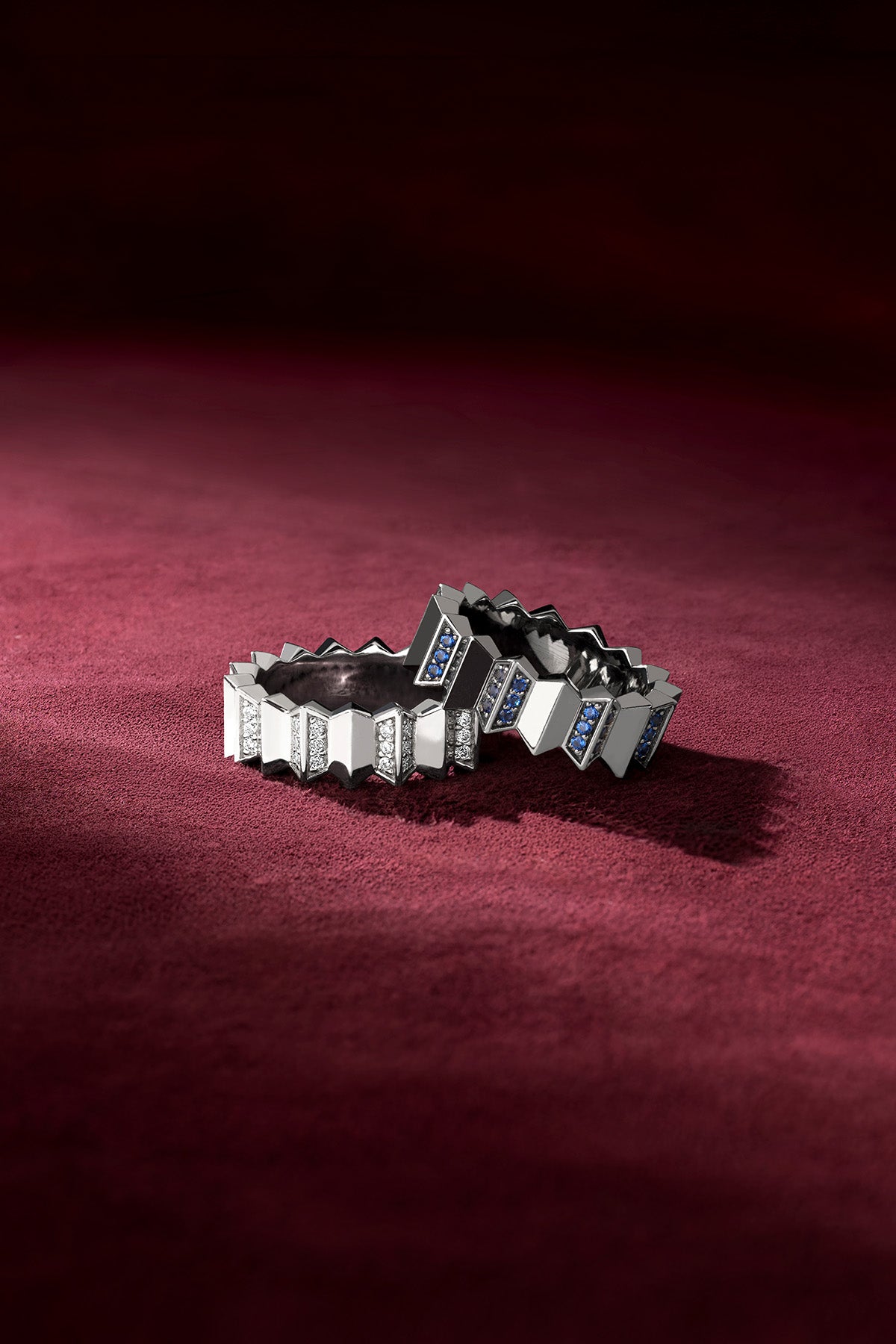 APM Rings in rhodium finish, an architectural duo whispering bold elegance on velvet.