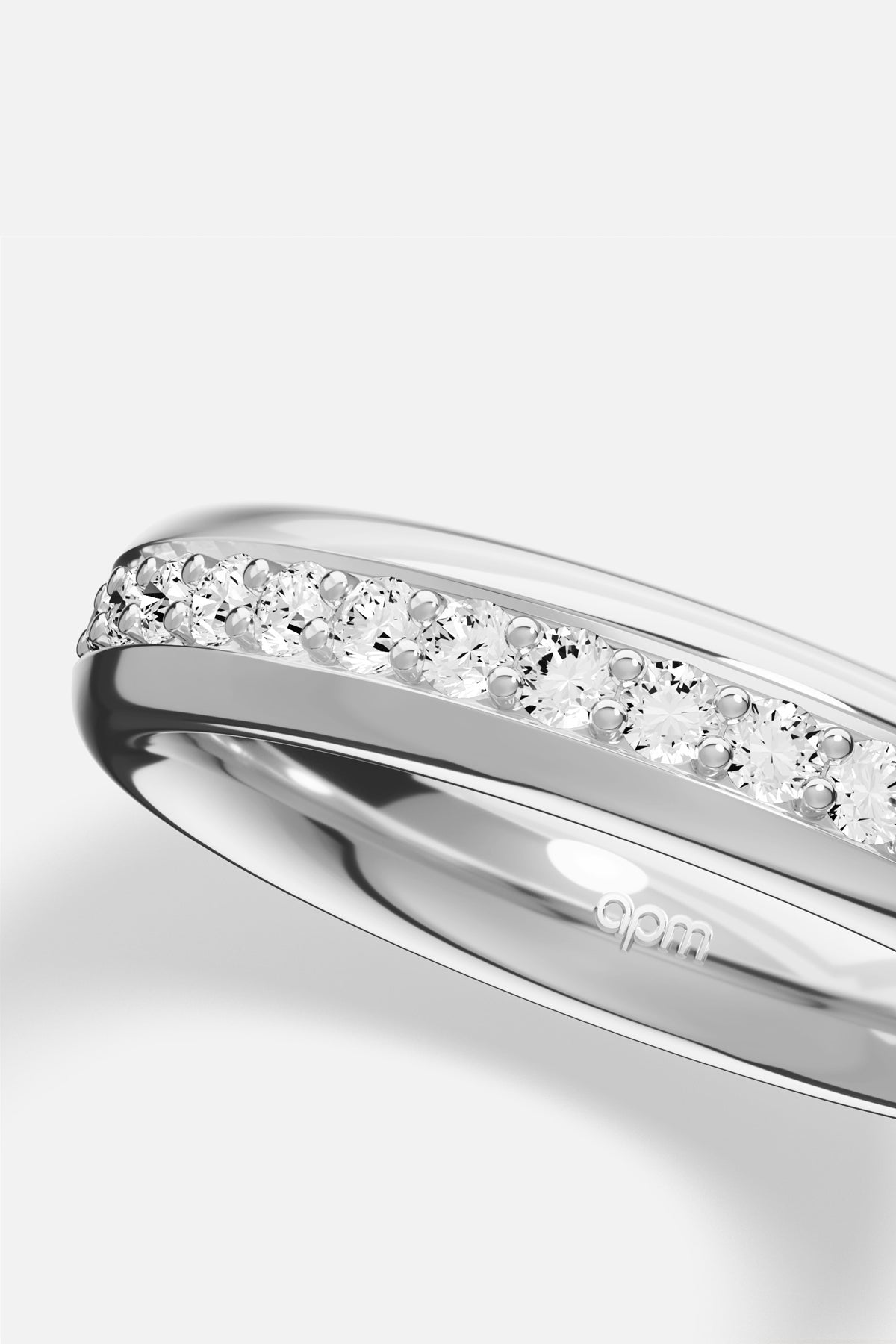 APM Ring in rhodium finish, a luminous line of sparkle for effortless elegance.