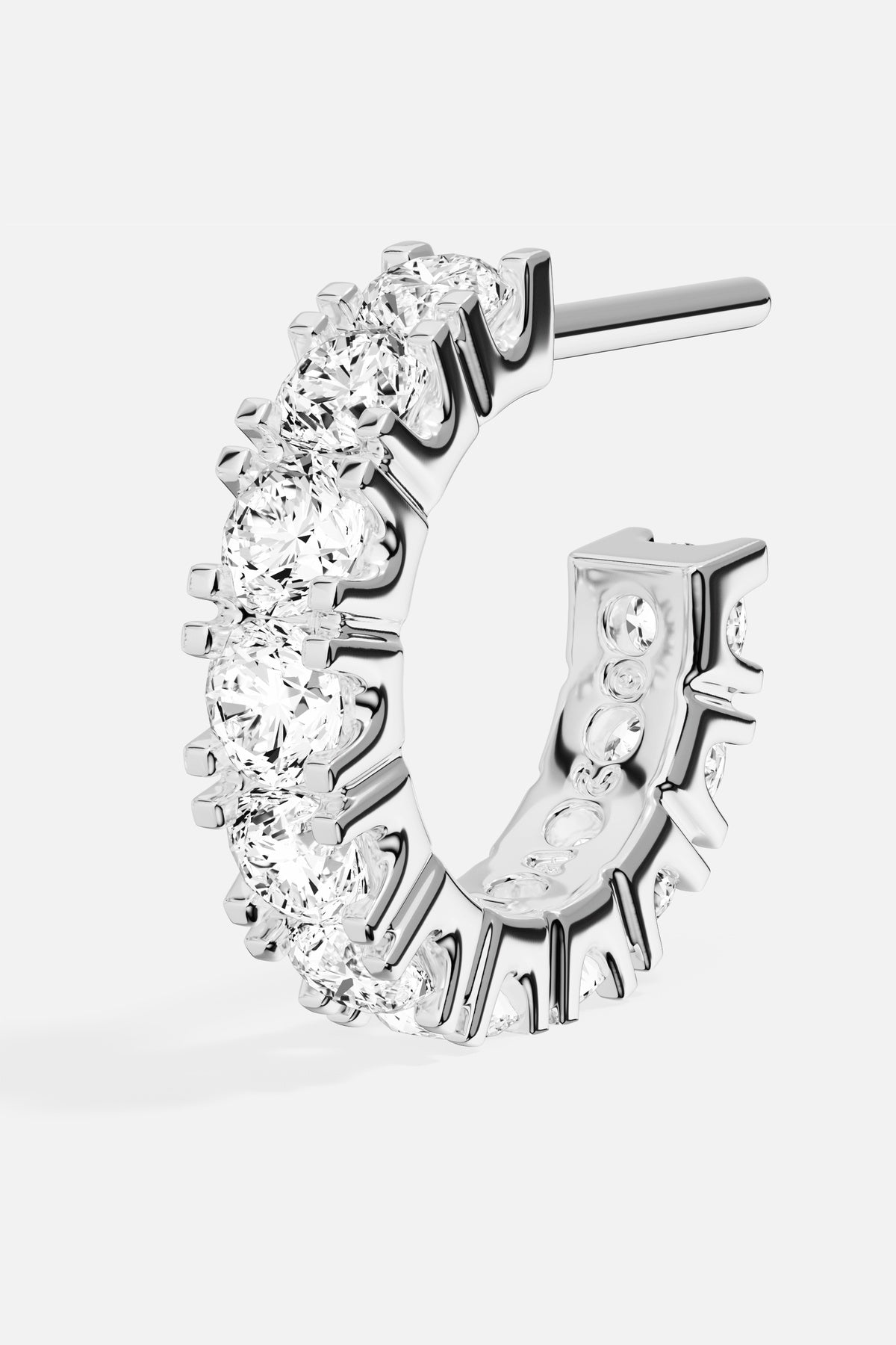 APM Hoop Earring in rhodium finish, radiant sparkle with an effortlessly modern glow.