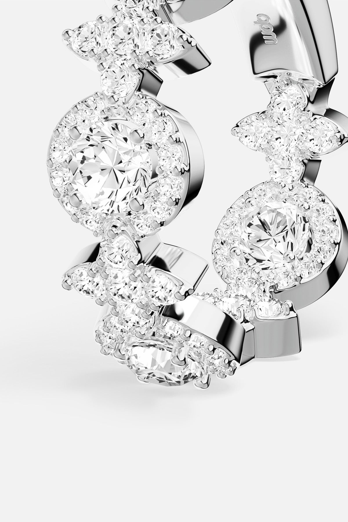 APM Ring in rhodium finish, a luminous dance of florals and radiant halos.