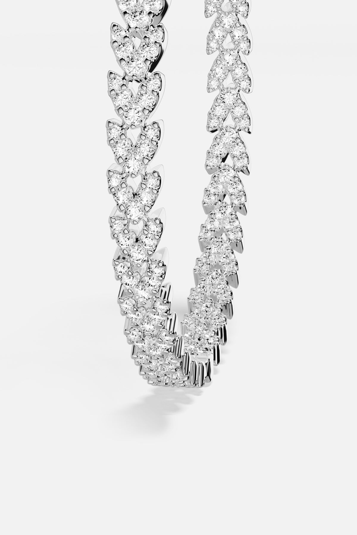 APM Necklace, a shimmering cascade of light in rhodium finish.