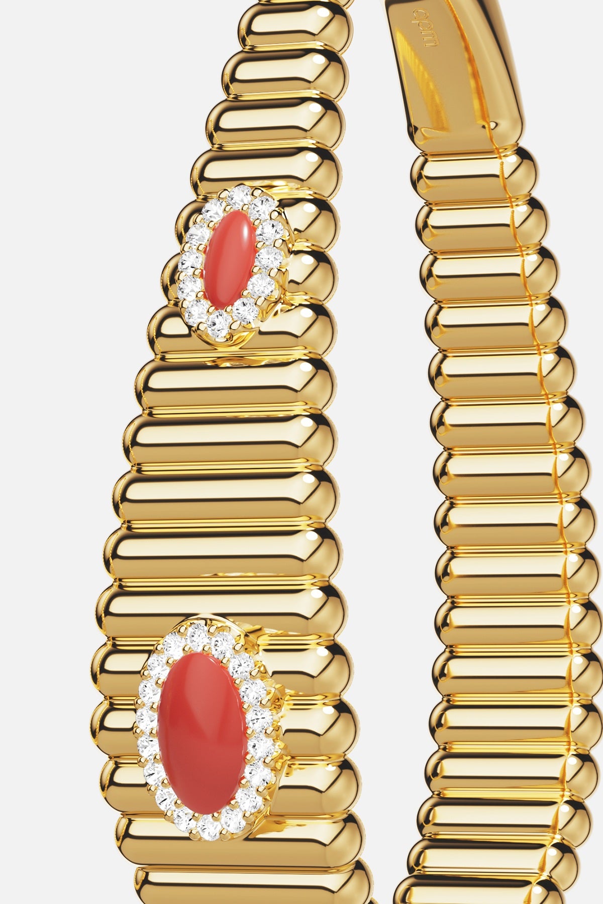 APM ribbed bangle in gold color, crowned with coral and shimmering halo elegance.