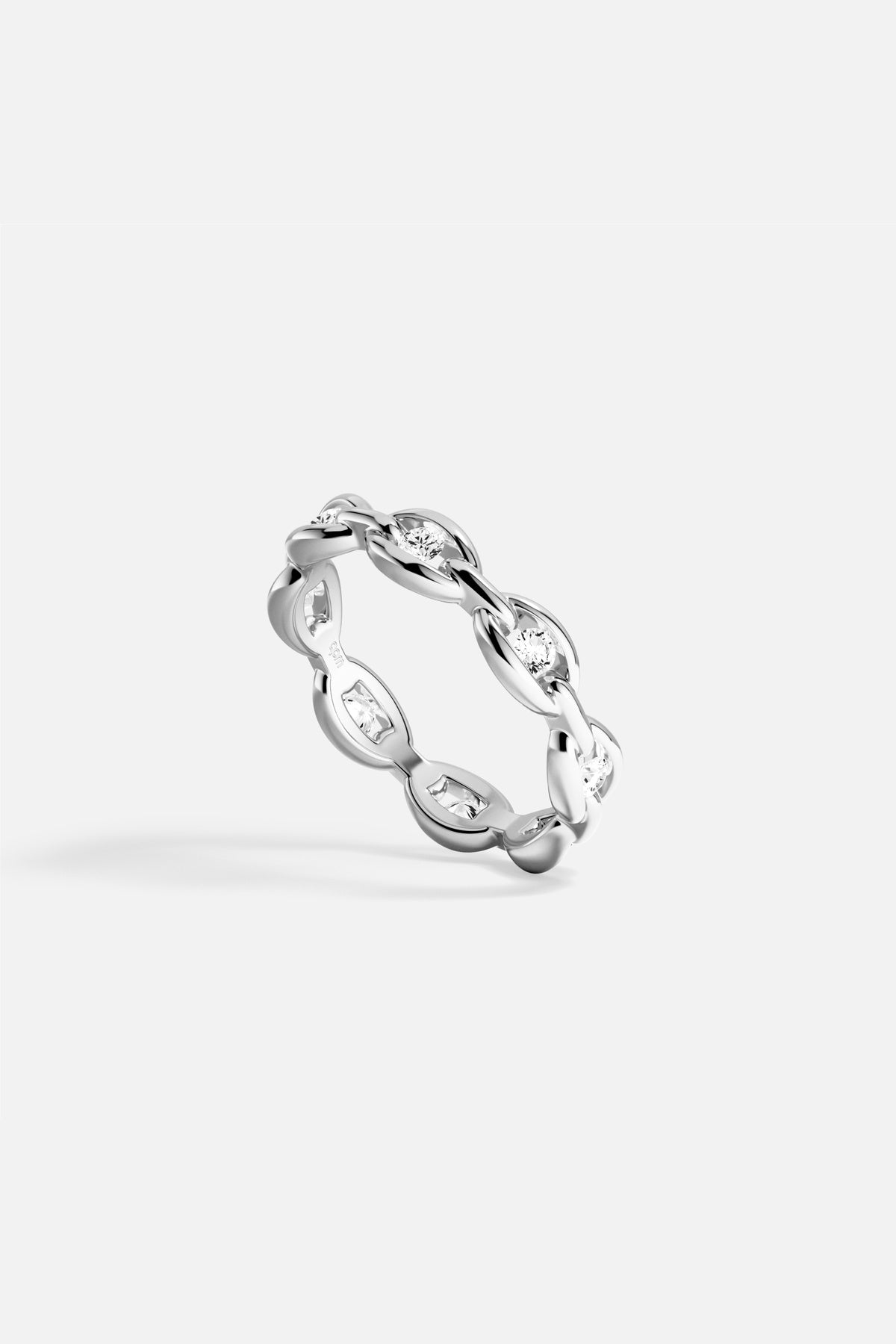 APM Ring, a fluid chain of light in rhodium finish.