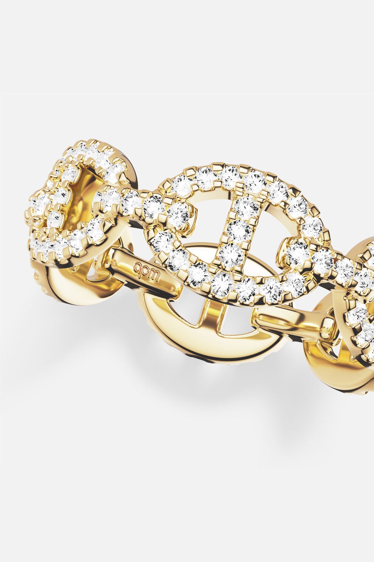APM Morse Ring, a golden shimmer of bold links and quiet sparkle.