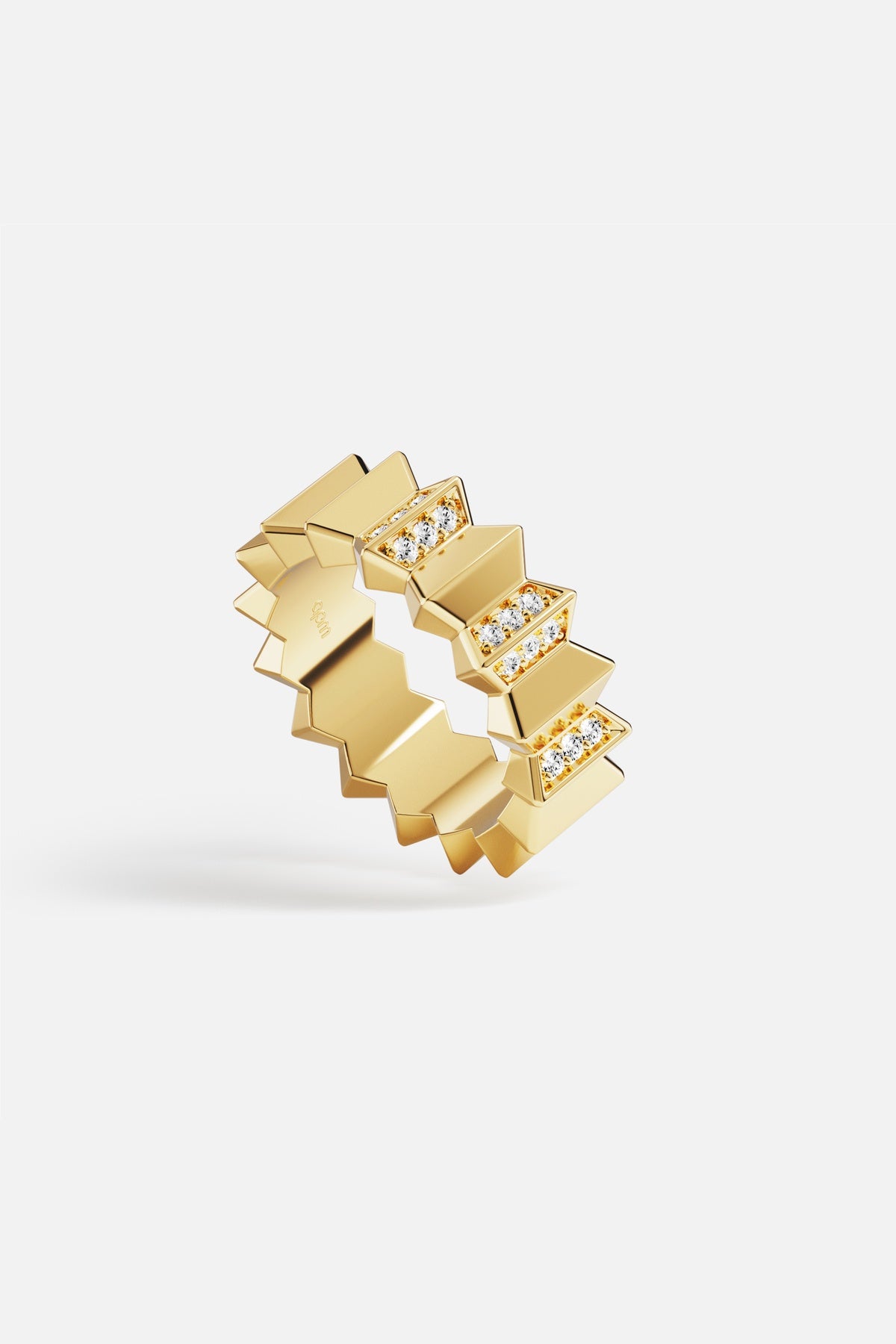 APM ring in golden color, sculpted edges and sparkling accents for bold modernity.