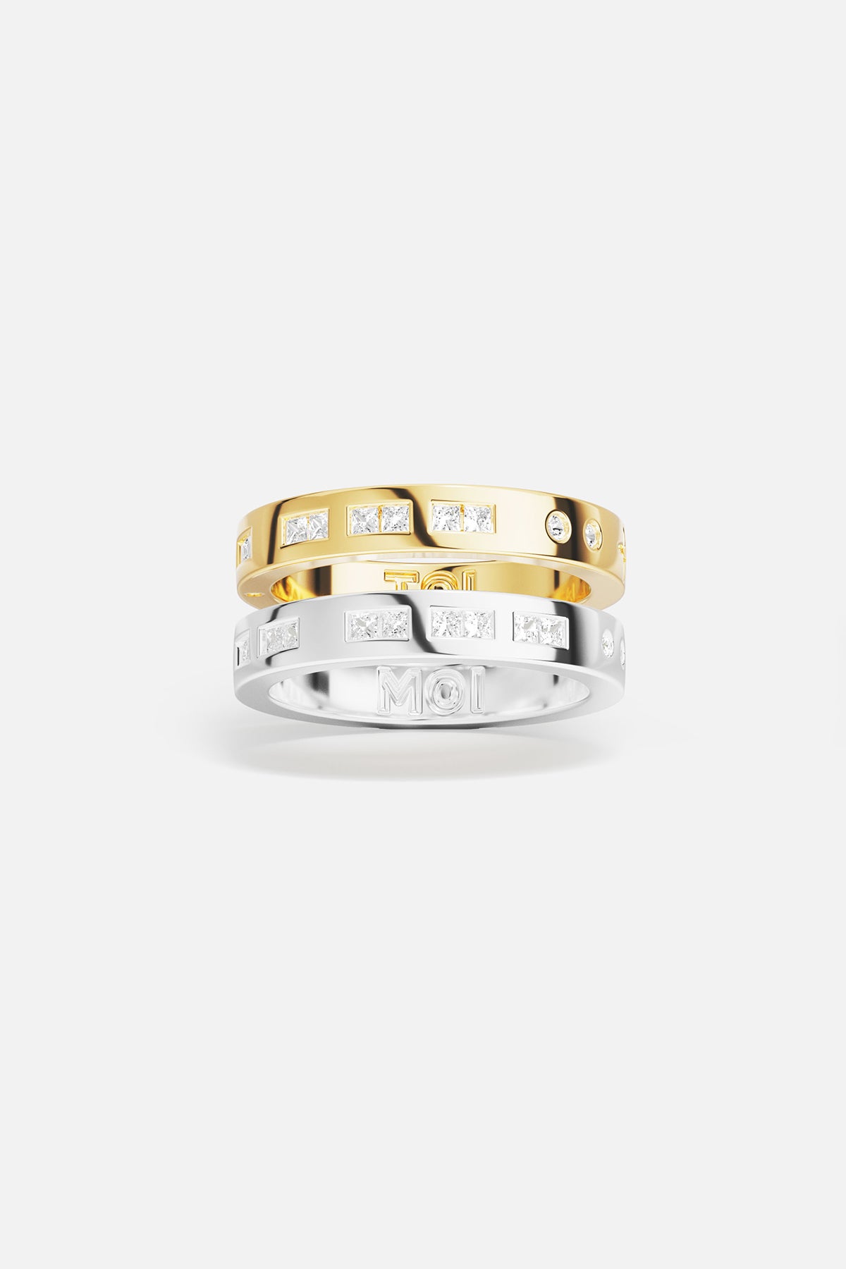 Rings APM Monaco: two stacked rings, yellow gold and white gold, white cubic zirconia, one with MOI engraving.