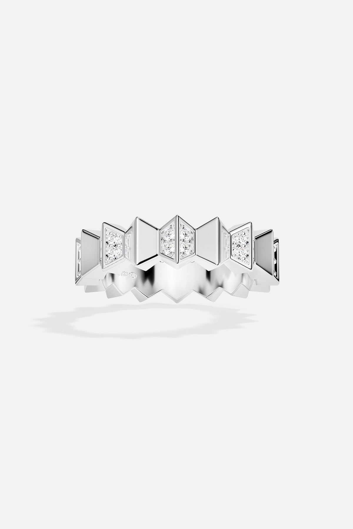 Silver ring with geometric design on a white background