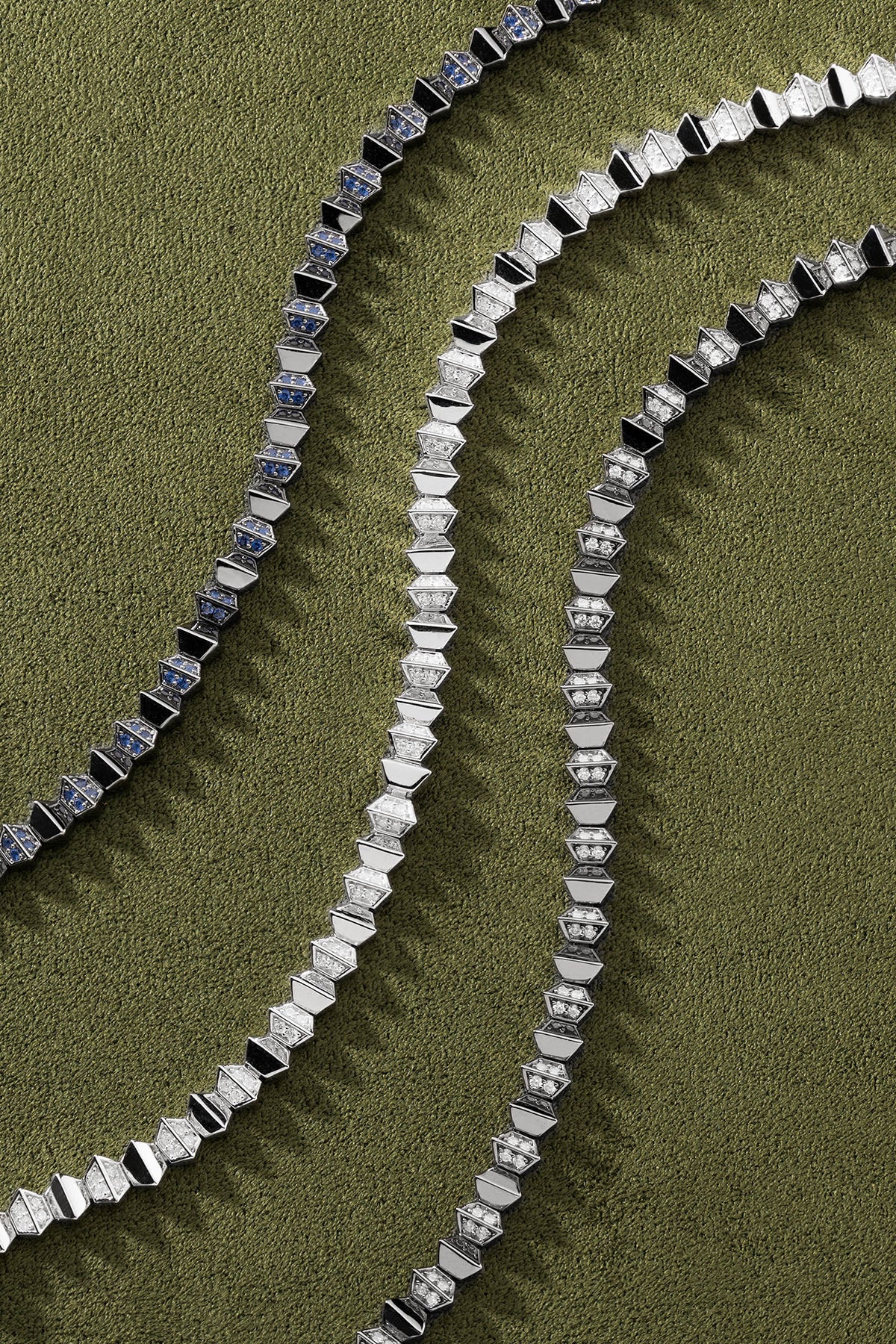 APM Monaco Up and Down Bracelet in silver on a green background