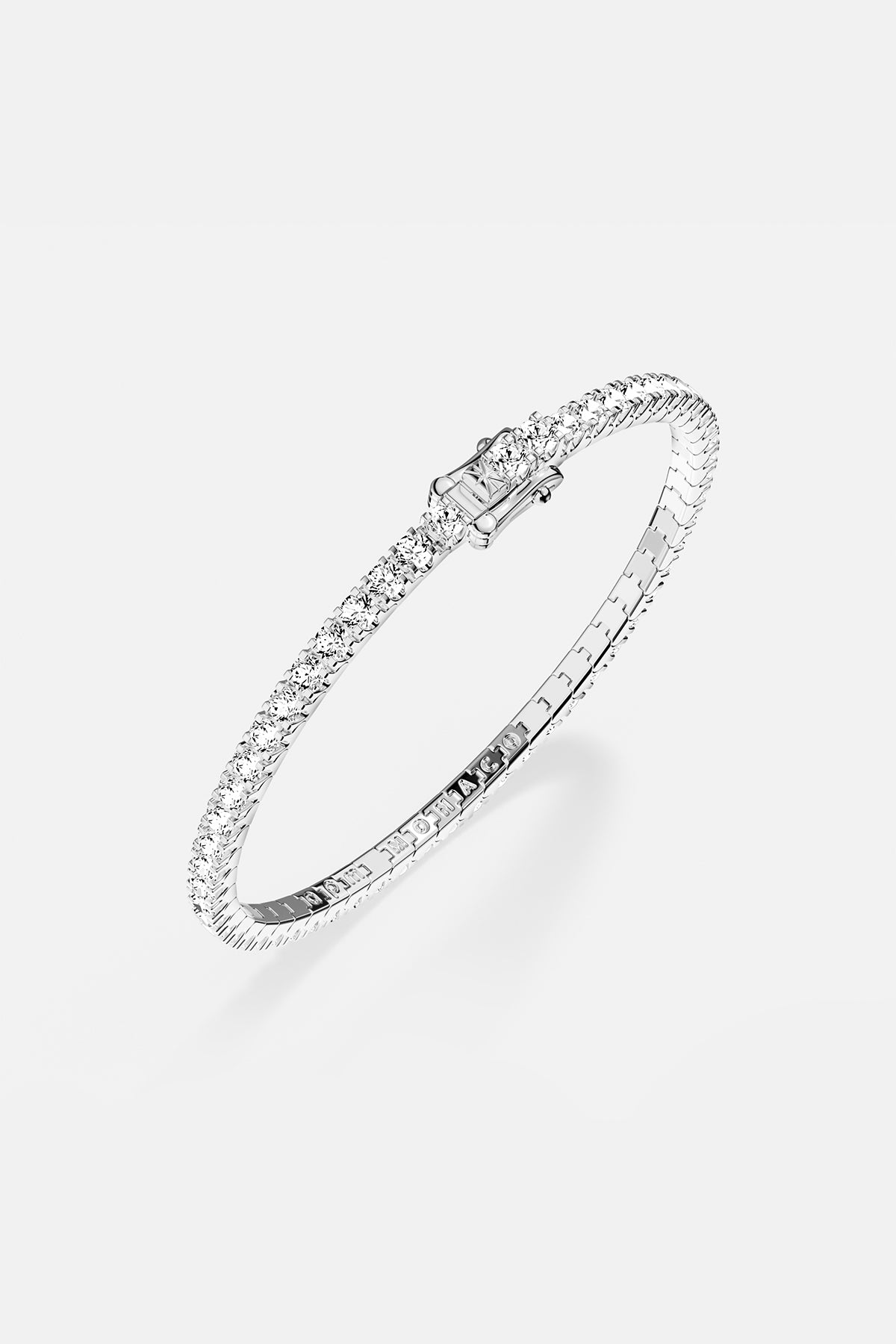 Bracelets APM Monaco pavé white stones on a silver-tone bracelet.