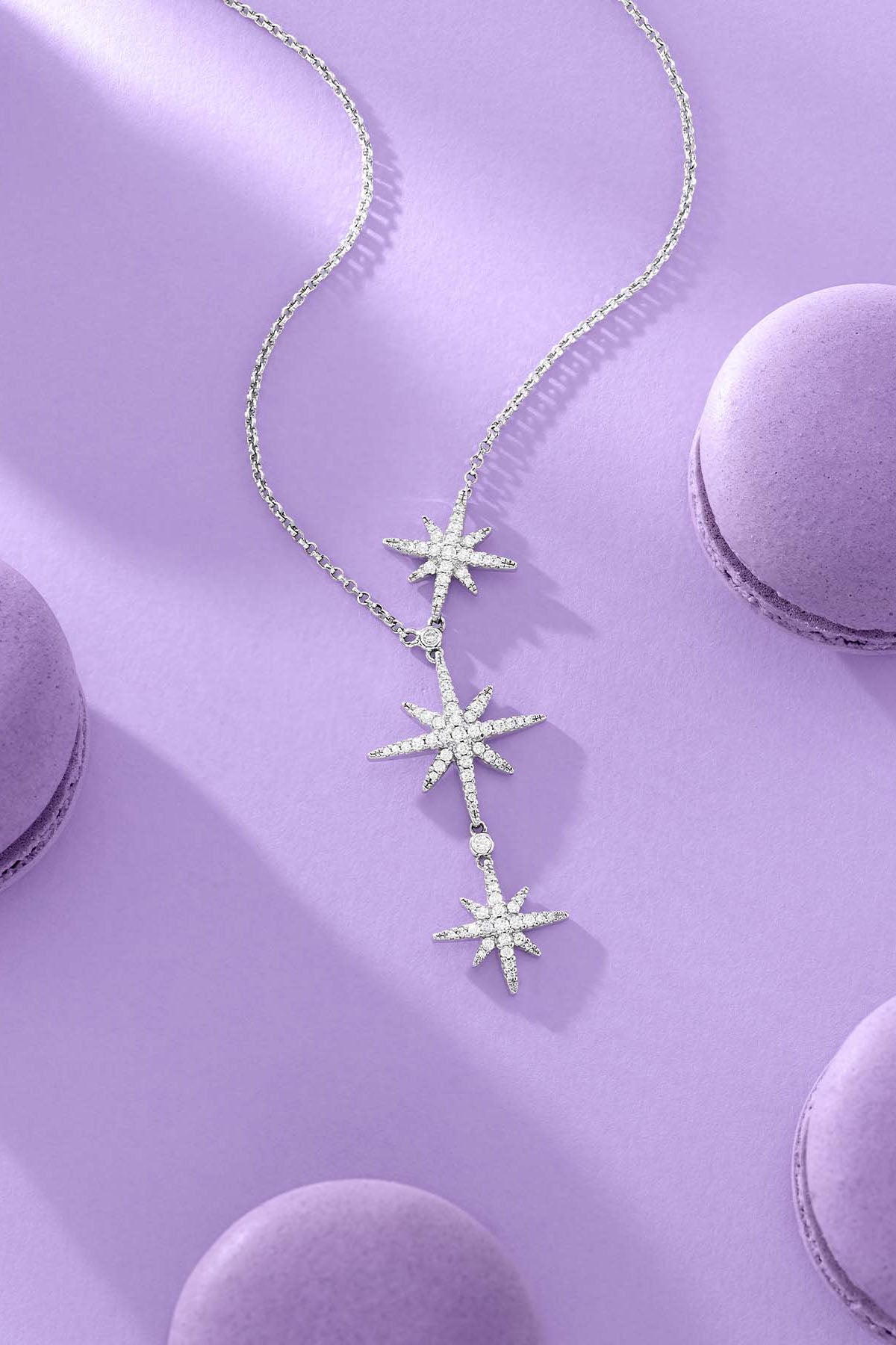 APM Monaco Triple Meteorites Adjustable Necklace on lilac background with macarons