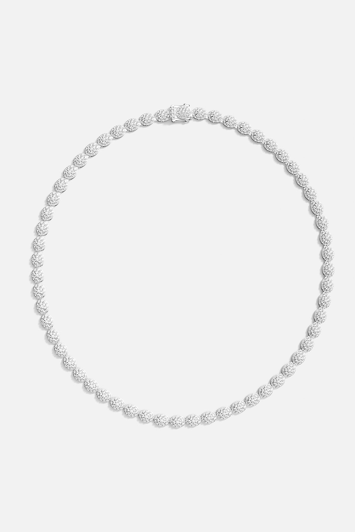 APM MONACO pave necklace in silver on a light gray background