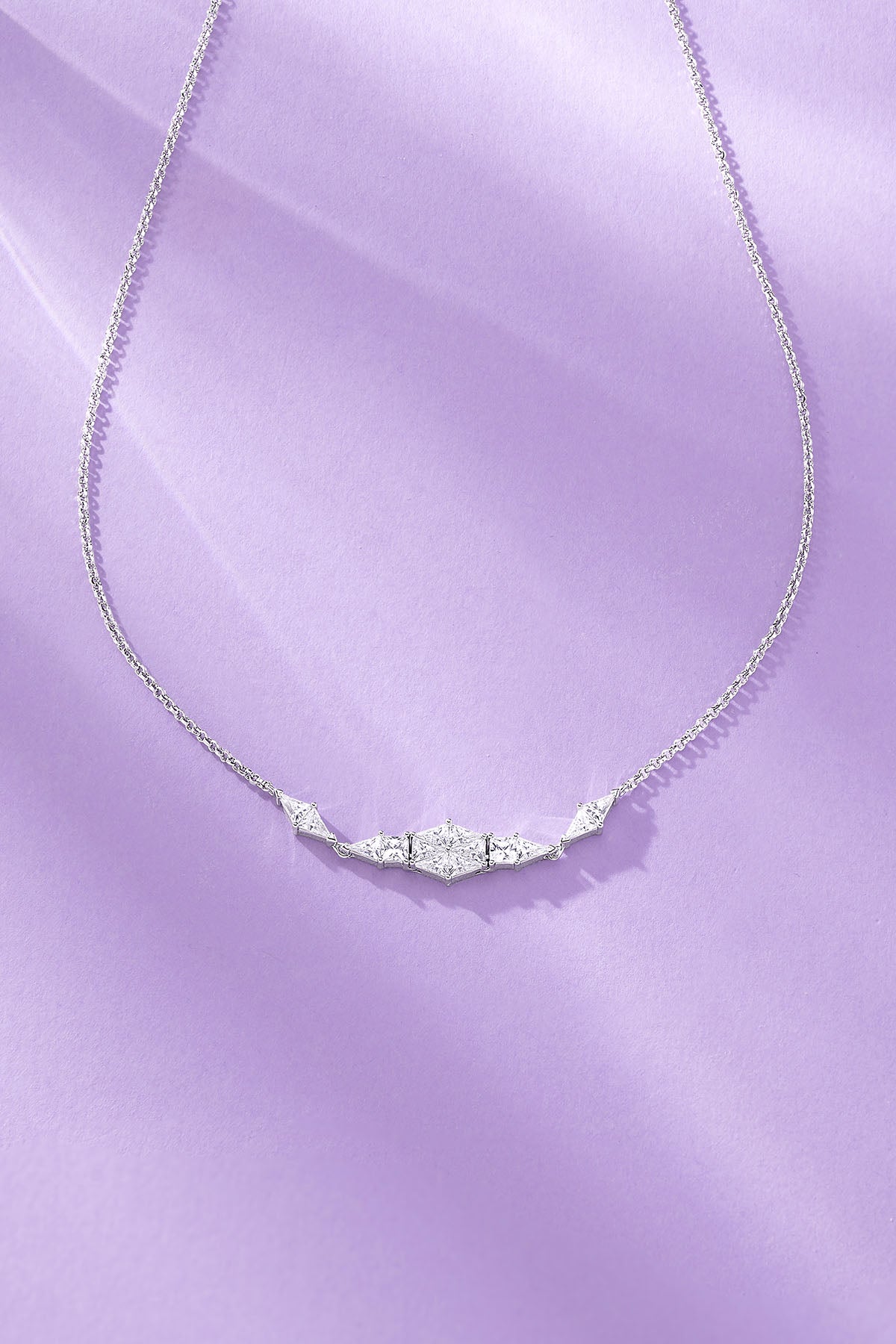 Art Deco Adjustable Necklace on a purple background