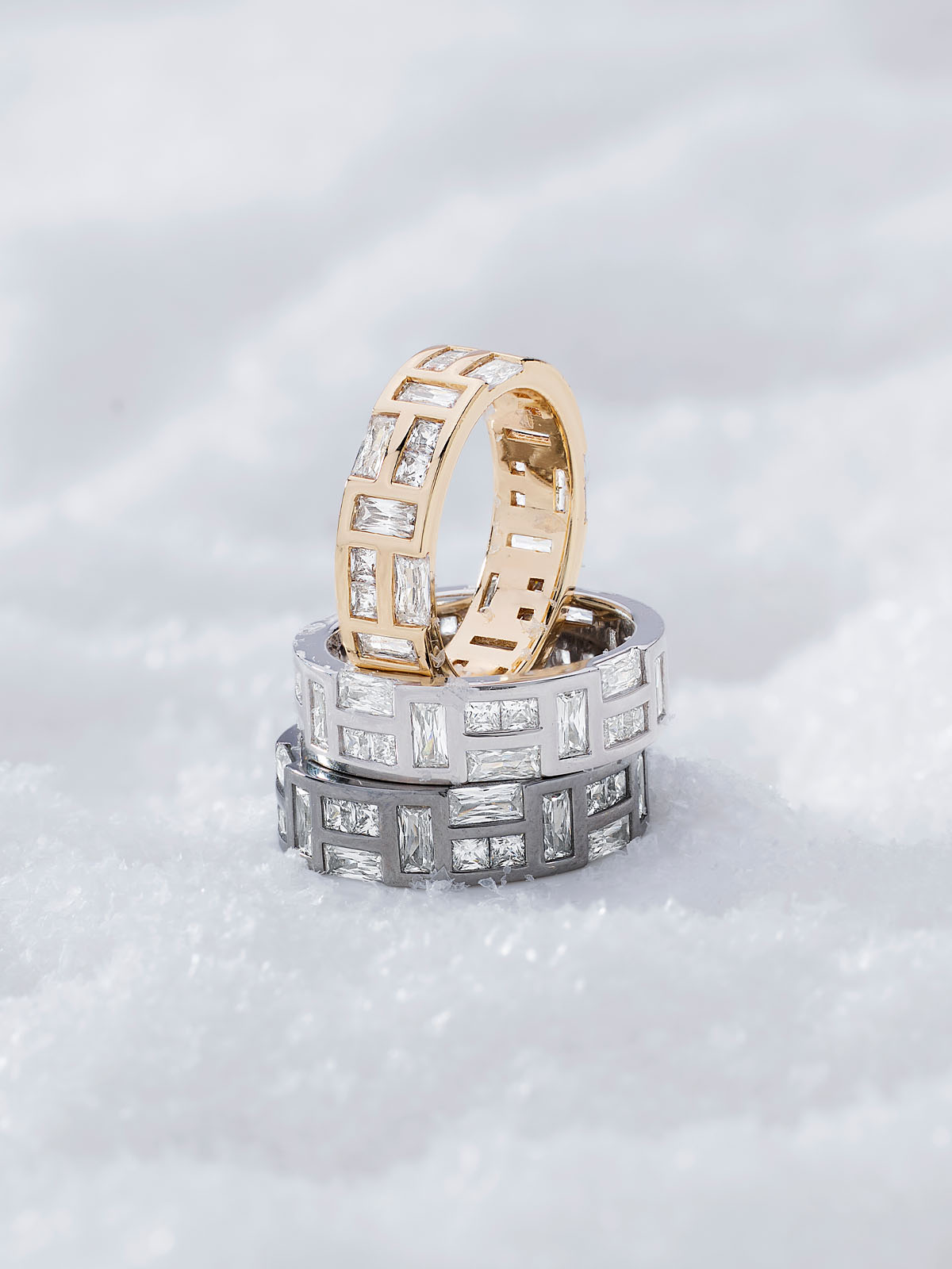 Three Hiver Labyrinth rings from APM MONACO stacked on a white background