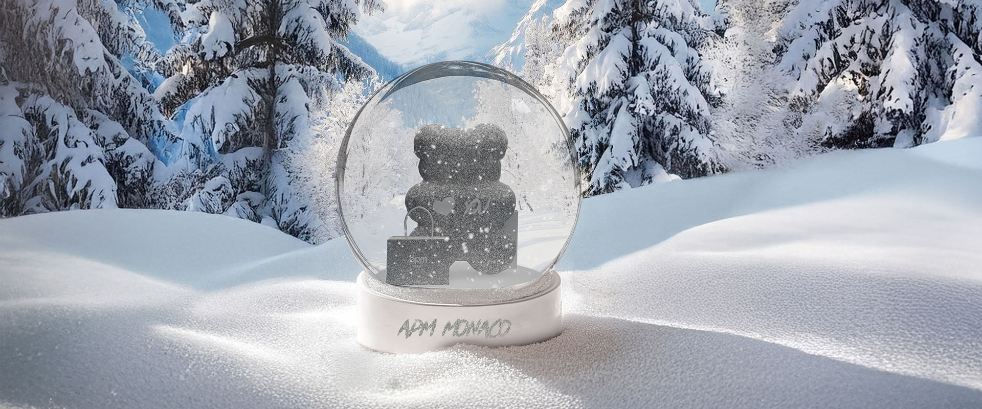 APM MONACO snow globe with a teddy bear inside on a snowy landscape with trees.
