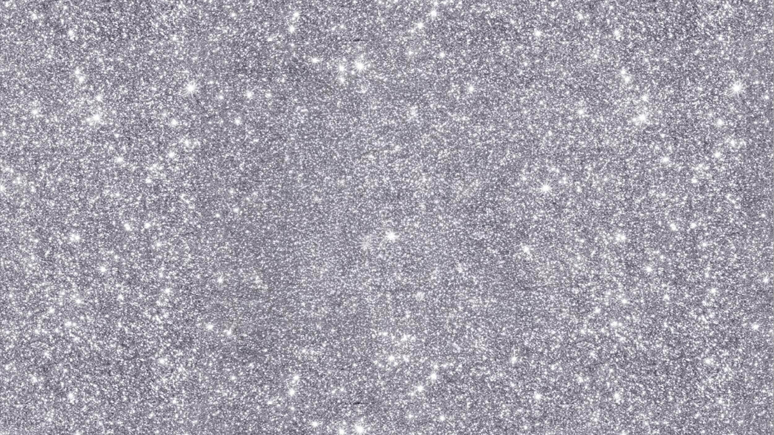 Silver glitter texture on a gray background
