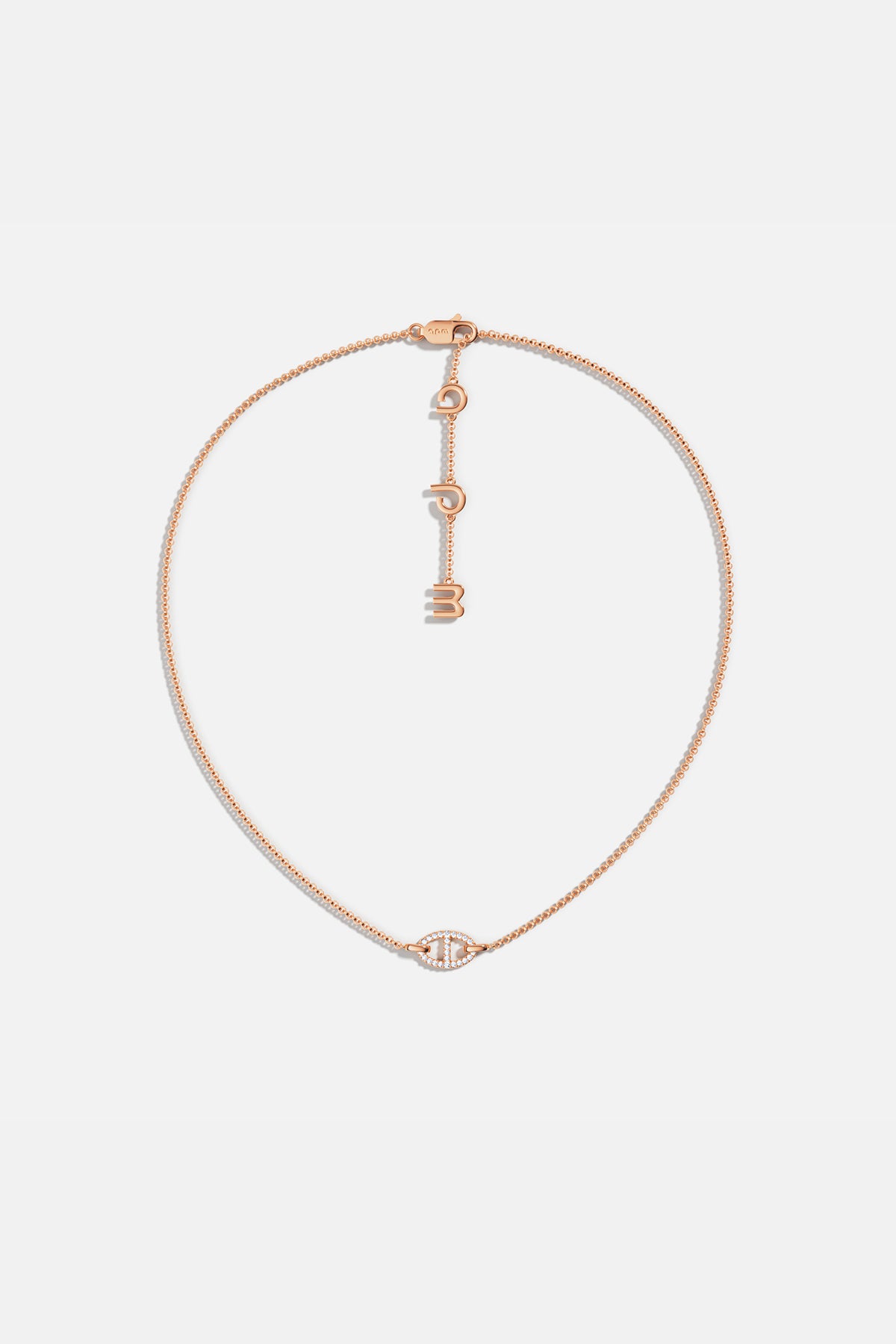 APM MONACO rose gold necklace with unique pendant on a white background