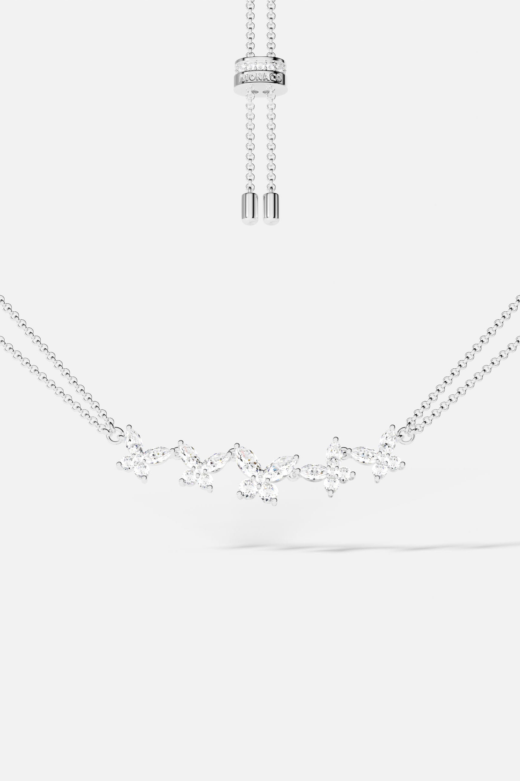 Necklaces APM Monaco: butterfly-pattern necklace with cubic zirconia on a double-chain, adjustable length in silver-tone metal.