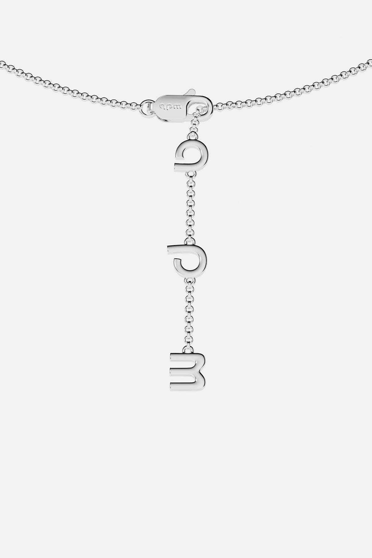 Silver necklace with hanging charms on a white background