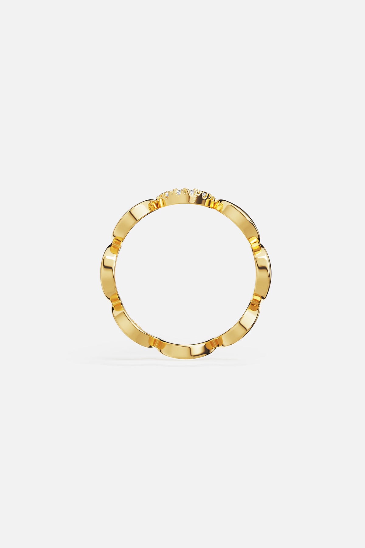 Rings APM Monaco yellow gold wavy pave ring with a row of diamonds along one side.