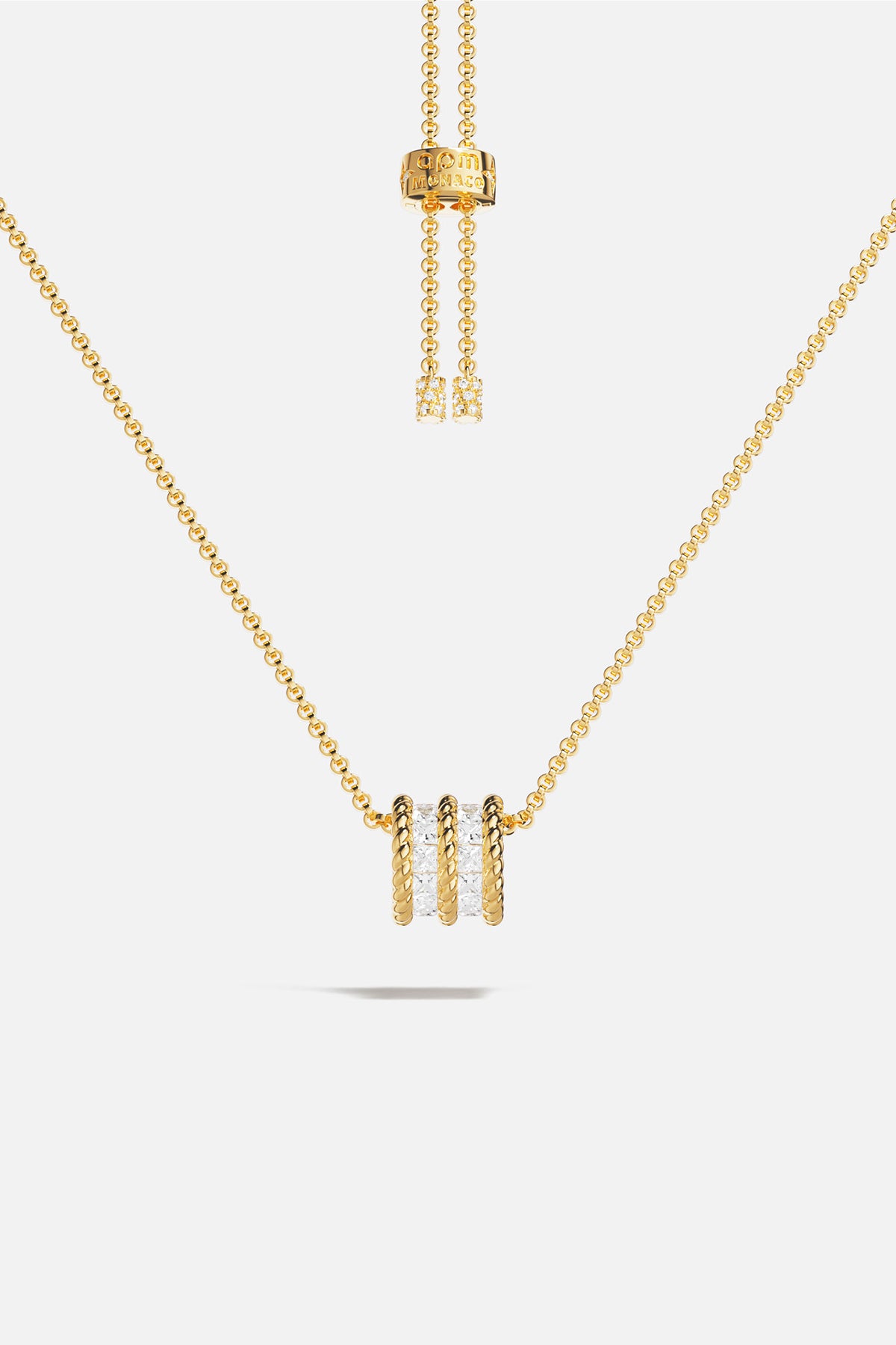 APM MONACO yellow gold adjustable necklace with white stones on a white background