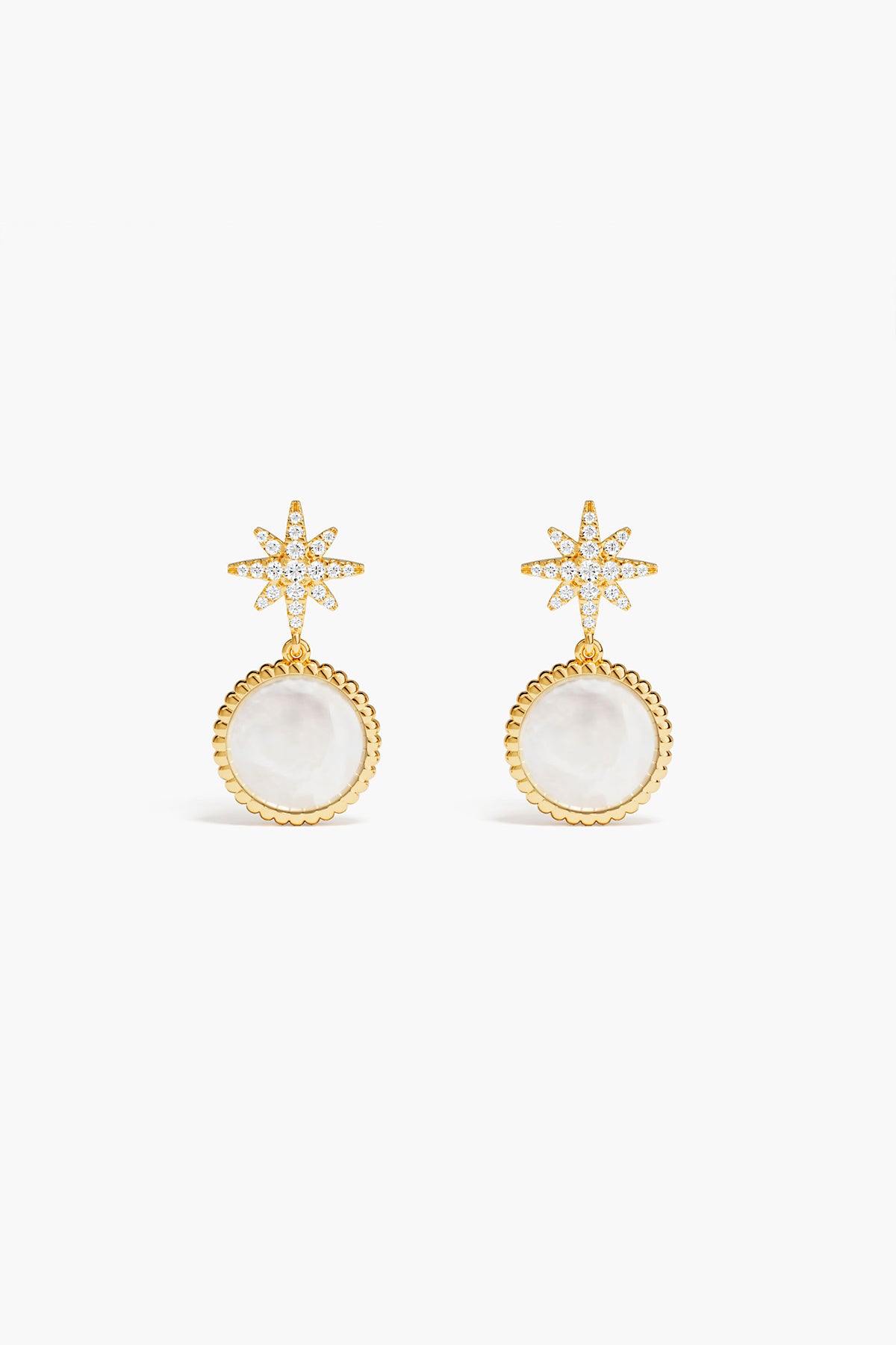 Gold earrings with star-shaped tops and white round stones on a white background